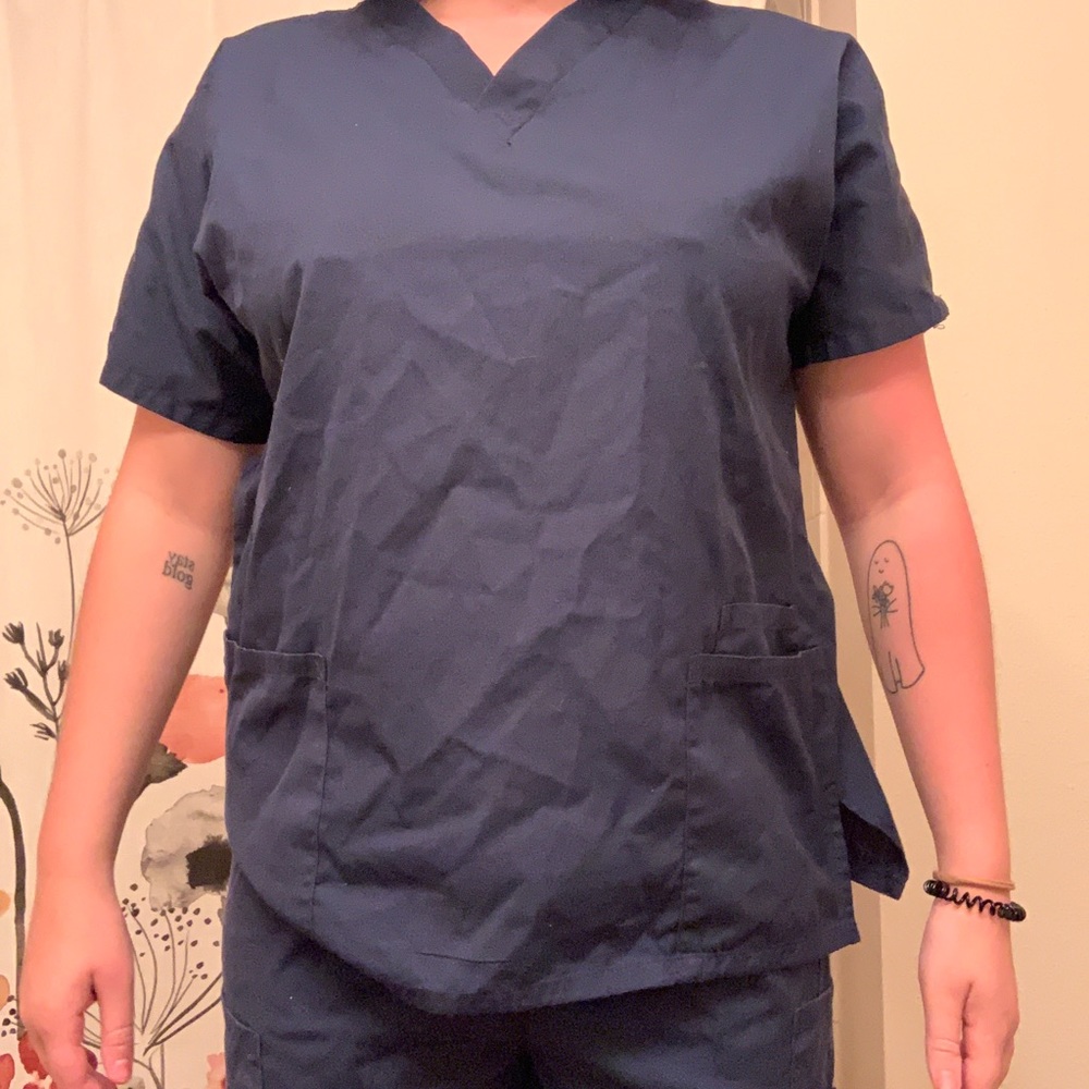 Scrub shirt and 2 pairs of scrub pants.